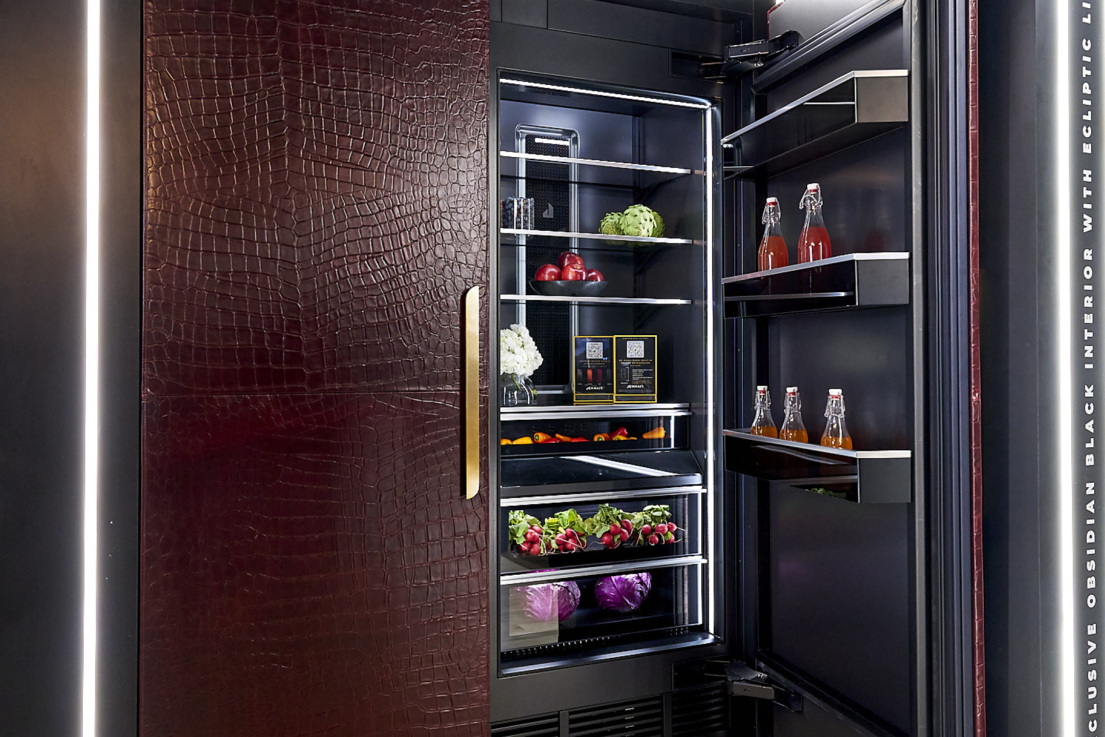 Modern kitchen featuring stainless steel appliances, grey and white cabinets, and white countertops.